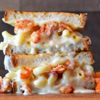 Lobster Grilled Cheese · White cheddar mac and cheese topped with lobster claw meat, provolone and mozzarella cheese ...