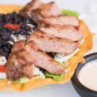 Steak Salad · Grilled steak in a deep fried flour tortilla shell filled with roman lettuce, tomatoes, bell...