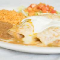 Enchiladas Suizas Plate (2) · Chicken enchiladas smothered in pork green chile, topped with jack cheese and Mexican-style ...