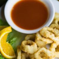Calamari Rings · Deep-fried battered calamari rings and served with sweet sriracha sauce.