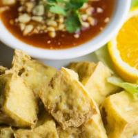 Fried Tofu. · Firm tofu deep-fried to a golden brown. Served with sweet chili sauce