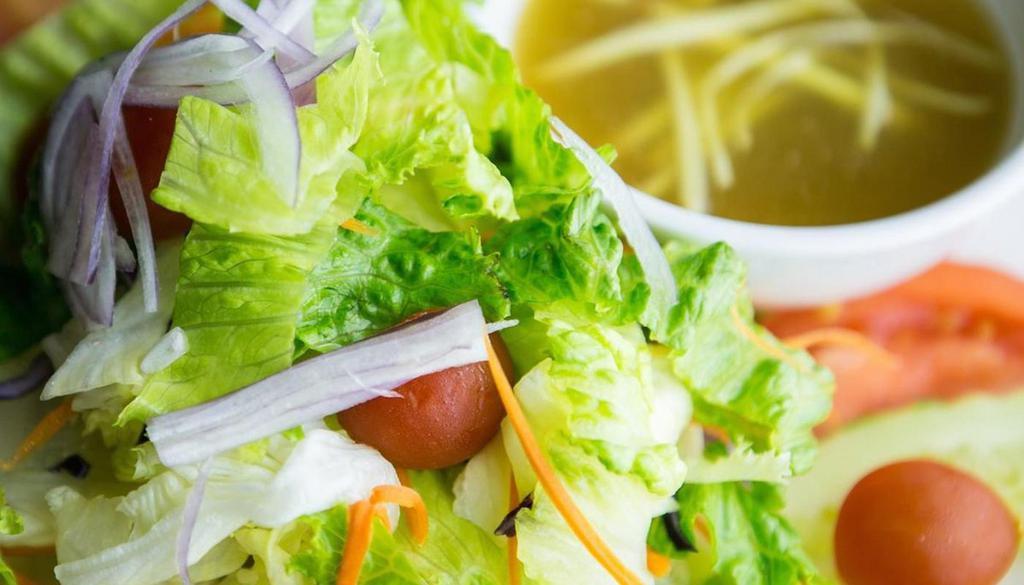 Thai Ginger Green Salad · Seasonal mixed green vegetables including cucumber, onion and tomato. Served with ginger dressing.