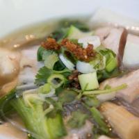 Tofu Soup. · Bean thread noodle, Napa cabbage, spinach, celery, onion and soft tofu in a clear broth. (Av...
