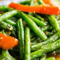 Green Beans Chili Sauce. · Green beans flash fried then stir-fried in our house roasted chili sauce with red bell peppe...