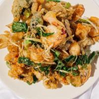 Ginger Prawns · Battered prawns and seasonal vegetables deep fried to perfection then topped with our chef’s...
