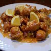 Orange Chicken. · Crispy fried boneless chicken breast covered in a sweet and savory homemade sauce.  Served w...