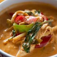 Red Curry. · Red curry cooked with coconut milk, bamboo shoots, sweet basil and bell pepper.