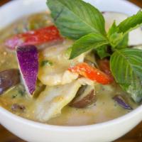 Green Curry. · Green curry cooked with coconut milk, eggplant, bell peppers and sweet basil.