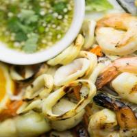 Talay Paow · Combination of grilled seafood: jumbo prawns, scallops, calamari and mussels. Served with fr...