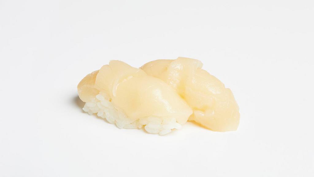 Scallop Nigiri · Two pieces of scallop over pressed sushi rice.