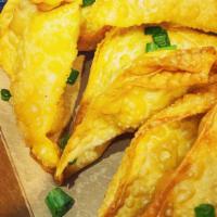 Cream Cheese Wontons · 4 Golden brown, deep fried wontons stuffed with green onion cream cheese and served with a h...