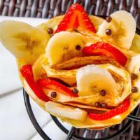 Strawberry Banana Crepe · Sliced strawberries, sliced bananas, custard cream, whipped yogurt, chocolate pearls, crushe...