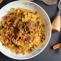 Goat Biryani · Aromatic rice dish made with saffron basmati rice with layers of marinated, bone-in goat and...