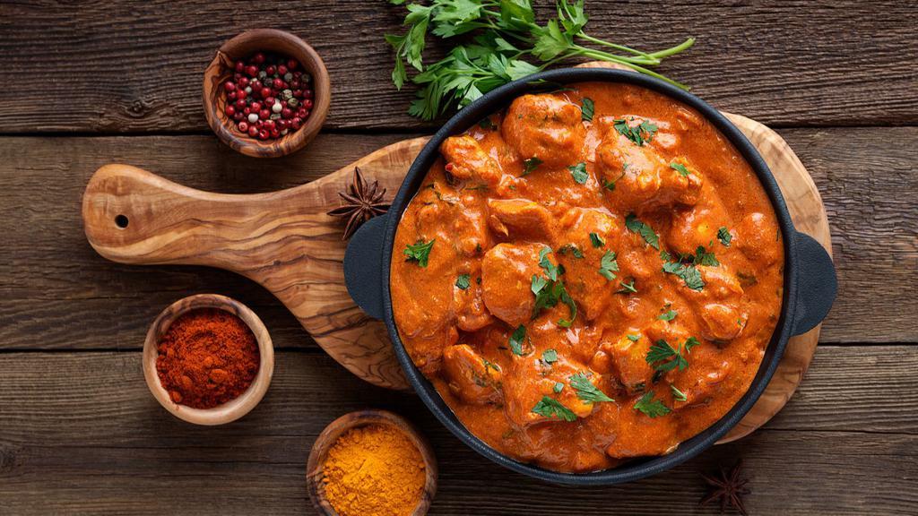 Butter Chicken Plate · Crazy good butter chicken plate! with butter masala sauce on boneless chicken, customers choice of base, sauce and topping.