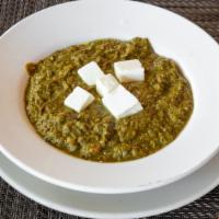 Palak Paneer · Tender chunks of Indian cottage cheese cooked in a creamy spinach sauce