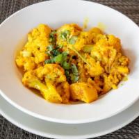 Aloo Gobhi · Potato and cauliflower sautéed with onions, tomatoes and Indian herbs