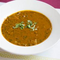 Dal Makhani · Delicately spiced and gently simmered black lentils