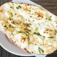 Garlic Naan · White leavened garlic sprinkled bread baked in clay oven