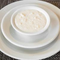 Rice Kheer · Rice pudding garnished with nuts and raisins