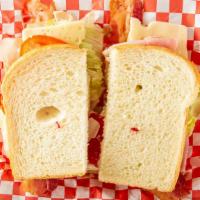 Club House Sandwich · Layered with ham , turkey and bacon, mayo, mustard, lettuce, tomato, and swiss cheese.