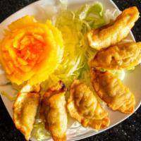 Chicken Dumplings (6) · Dumplings stuffed with chicken and vegetables.