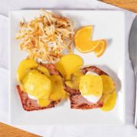 Traditional Eggs Benedict (B & D Benedicts) · Two poached eggs on an English muffin topped with hollandaise. Served with hash browns or gr...
