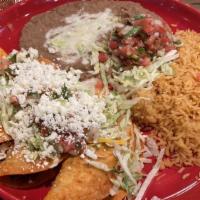 Tacos Al Carbón · Steak or chicken. Three soft tacos made with grilled marinated tortillas filled with flame b...