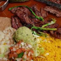 Carne Asada · Skirt steak seasoned and charbroiled to perfection! Served with guacamole. Garnished with Pi...