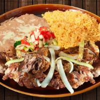 Pork Carnitas · Tender pork fried with onions and spices. Garnished with lettuce and Pico de Gallo.