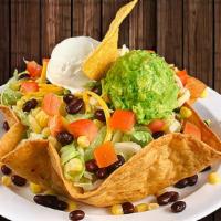 Antojo Taco Salad · With your choice of shredded chicken, shredded beef or ground beef. Both refried and black b...