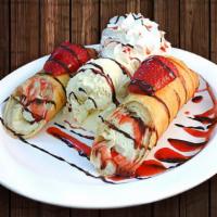 Burrito Cheesecake · Creamy vanilla cheesecake wrapped in a flour tortilla, fried 'till crispy. Served with a sco...