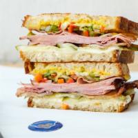Cubbie Cubano · Seared black forest ham with our house bacon, melty swiss, giardiniera, sliced pickles, mayo...