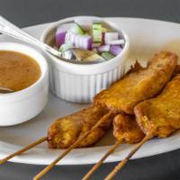Chicken Satay (4) · Gluten free. Skewers of chicken marinated in Thai spices served with our curry-based peanut ...