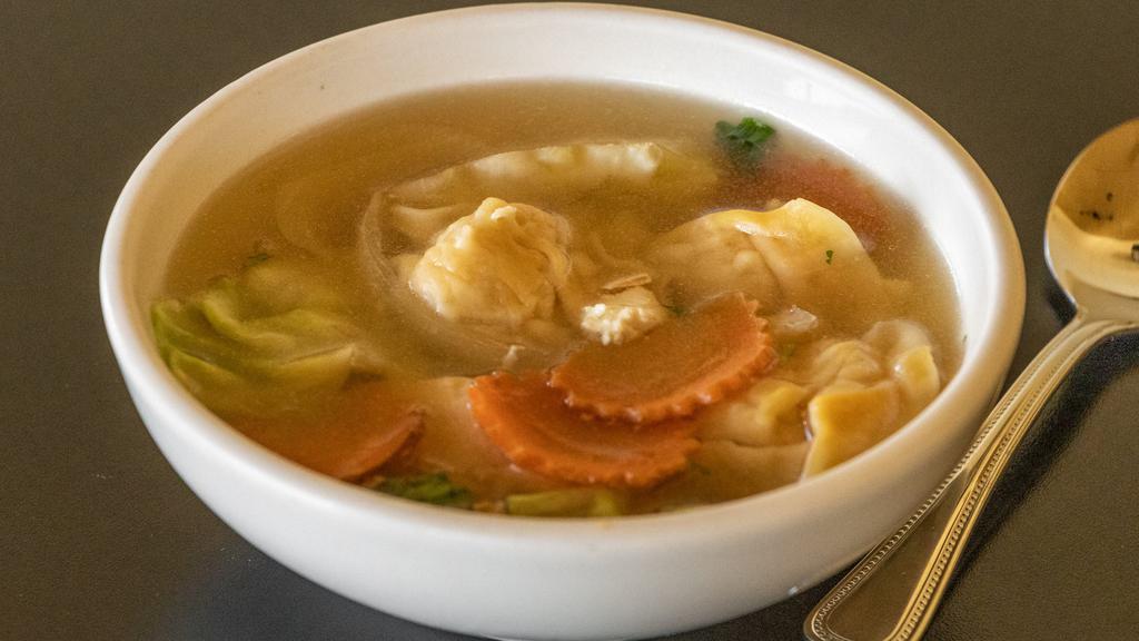 Wonton Soup · Minced chicken, stuffed wontons with choice of meat and bok choy, carrots, onions, garlic, cilantro, scallions in a clear seasoned broth.
