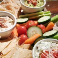 Dip Trio · Hummus, guacamole and artichoke dip served with veggies, flat bread and tortilla chips.