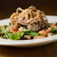Steak & Walnut Salad · A fresh mix of greens tossed with candied walnuts. Topped with grilled steak, blue cheese cr...
