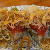 Red October · Crab meat, shrimp tempura, cucumber and avocado with spicy tuna on top.