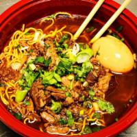 Birria Ramen · Thin Noodle, Ajitsuke Tamago (Marinate Egg), Slow Cooked Birria and Consome. Topped with Gre...