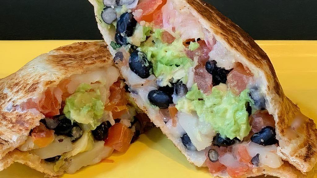 No 40 (Vegetarian/Vegan)* · Black beans, fresh tomatoes, avocados, sliced potatoes, shredded cheddar cheese, Zookz creamy picante buttermilk sauce. *For Vegans, we will substitute vegan, plant-based cheese and a chipotle veganaise sauce.  . Our gluten-free bread is NOT vegan, but our regular bread is.