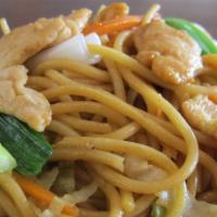 Chicken Lo Mein · Chicken lo mein is prepared with noodles with yellow onion, cabbage, carrot, and green onion.