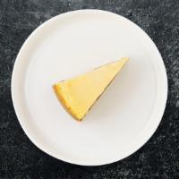 Cheesecake Of New York · A slice of classic NY Style cheesecake.