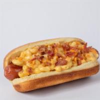 Mac N' Cheese Dog · Mugsy dog, mugsy sauce, mac n' cheese, bacon bits and crumpled cheese crackers.