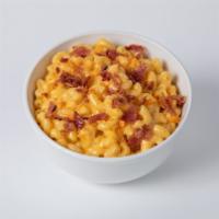 Mac N’ Cheese · Made fresh daily. Topped with cheese crackers and bacon bits.