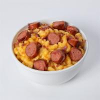 Mac N' Dogs · Mugsy dog sliced and added to our delicious mac n' cheese. Topped with cheese crackers and b...
