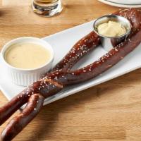 Brickhouse Pretzel · Hand-twisted, oven-baked, sprinkled with rock salt, and served with spicy mustard and green ...