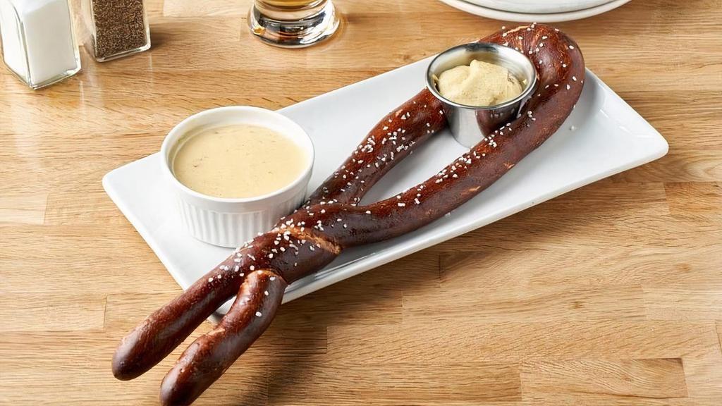 Brickhouse Pretzel · Hand-twisted, oven-baked, sprinkled with rock salt, and served with spicy mustard and green chile cheese sauce.