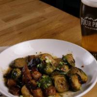 Miso Brussels & Pork Belly · Oven-roasted brussels sprouts tossed in miso sauce with Peach Ale-braised pork belly.