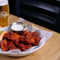 Boneless Wings · Tossed in your choice of buffalo, Golden Stout BBQ, Sweet Chili Peach, WoW Citrus Chili, Buf...