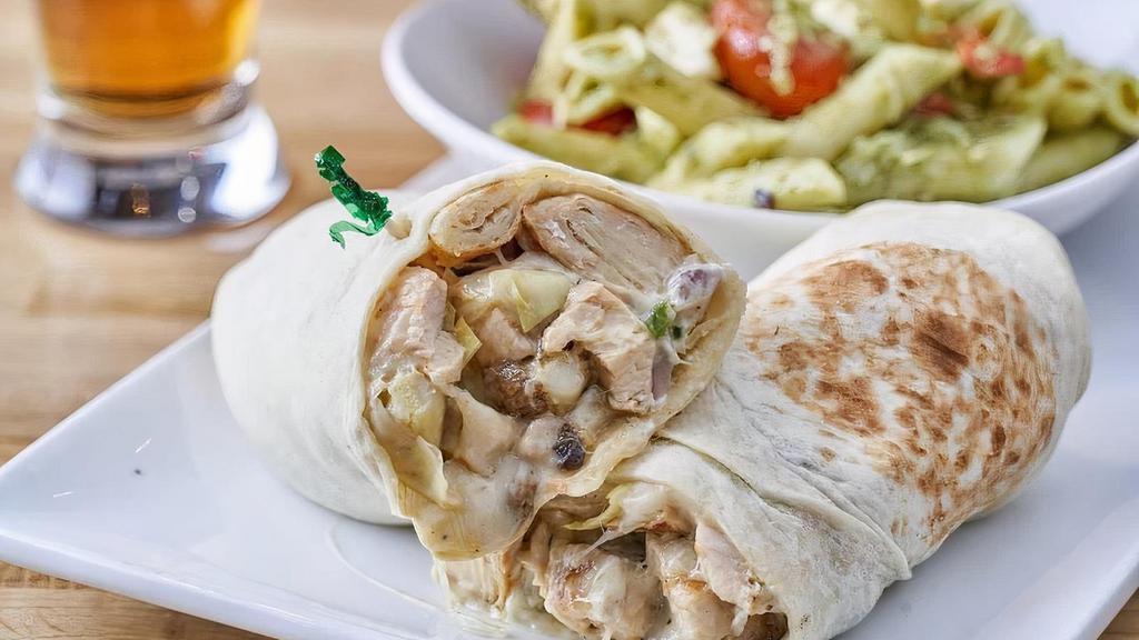 Chicken Beer Bread · Grilled chicken wrapped in golden lager beer bread with artichoke hearts, mushrooms, green peppers, red onions, mozzarella cheese, and creamy tzatziki sauce.