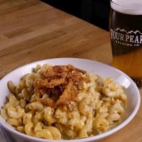 Green Chile Mac N Cheese · Cavatappi pasta tossed in house green chile cheese sauce, Anaheim chiles topped with cheddar...